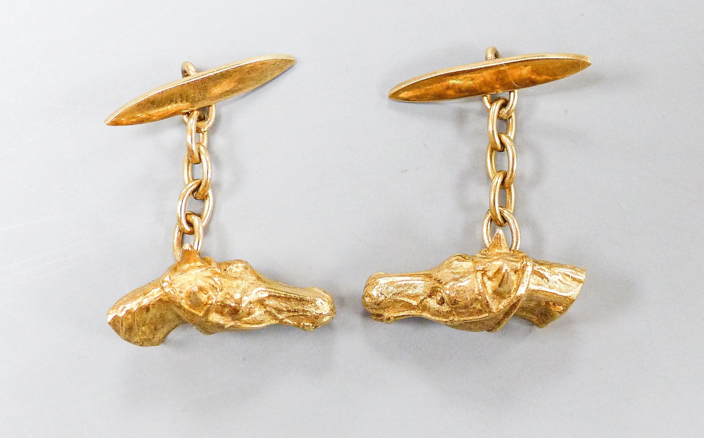 A modern pair of 9ct gold horse head cufflinks, 20mm, 10.3 grams.